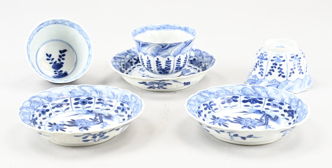 3x Chinese Kang Xi cup + saucer: Three 17th-18th century Chinese porcelain Kang Xi cups and saucers with garden decoration. Contoured. With base mark. One cup good. Two cups with minimal chips. Two saucers good. One saucer with a chi