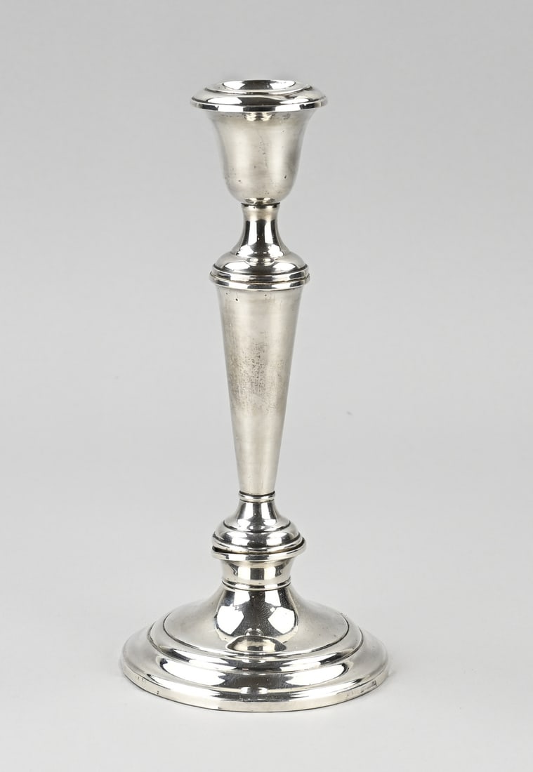 Silver candlestick: Beautiful silver candlestick, 925/000, on a round base, conical with a dent in the node at the base, which is filled. ø10x22cm. Gross weight approx. 460 grams. Also has a small dent, otherwise
