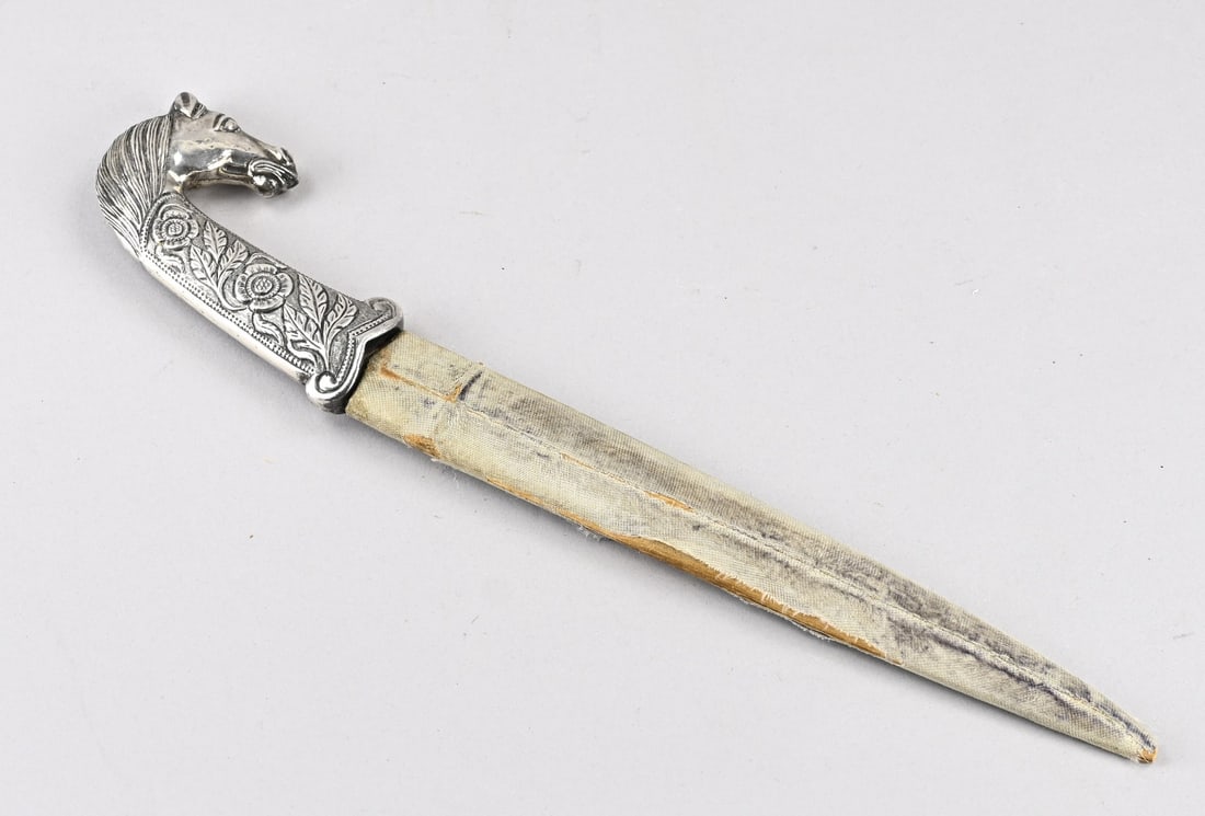 Dagger: Old Indian dagger with silver hilt, tested, floral + horse head. 20th century. Dimensions: L 39 cm. In good condition.