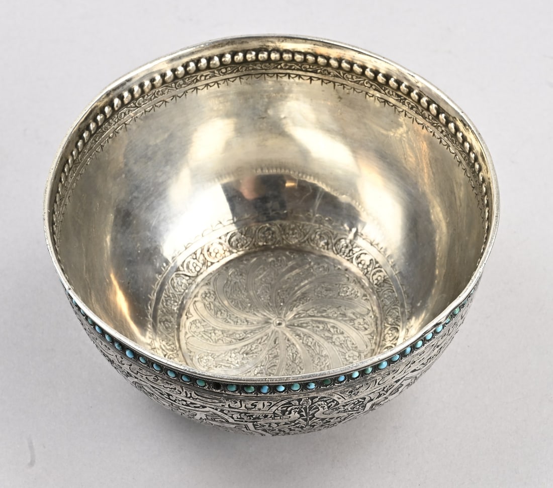 Silver bowl, Persia: Exceptional silver bowl, Persia, richly decorated with floral motifs and medallions with figures. Features a beaded rim with turquoise stones, a few are missing. ø12.5x6cm. Approx. 223 grams. In