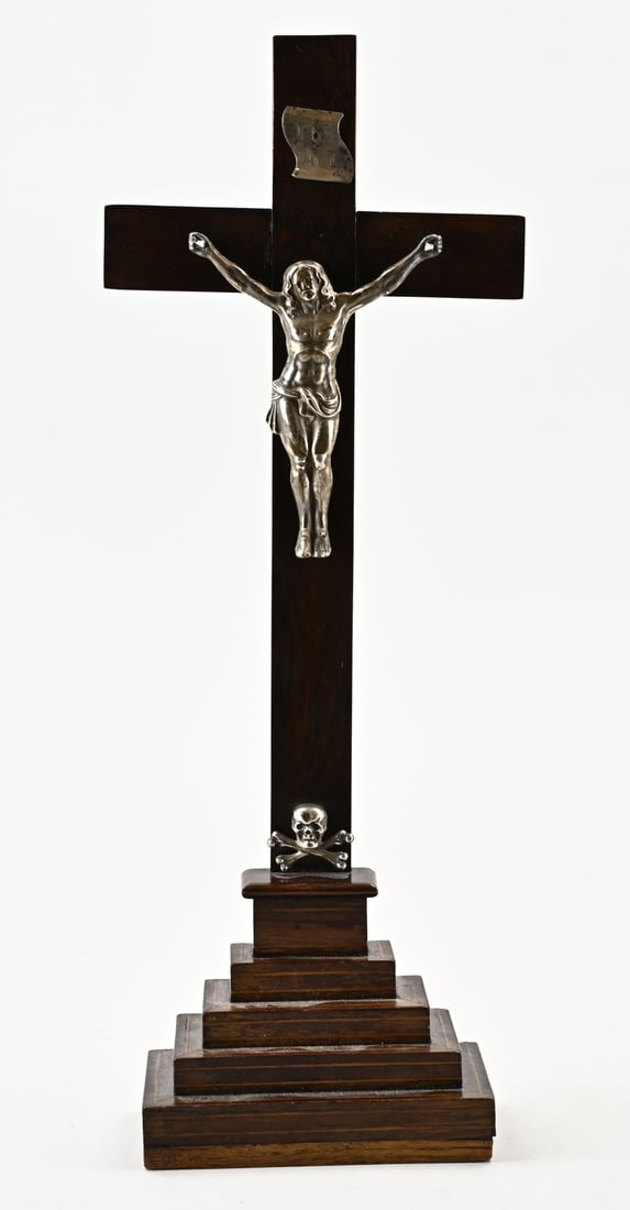Cross with silver Corpus Christi: Wooden cross decorated with a silver Corpus Christi, a silver skull, and plaque: INRI. 14x6.5x 37.5cm. In good condition.