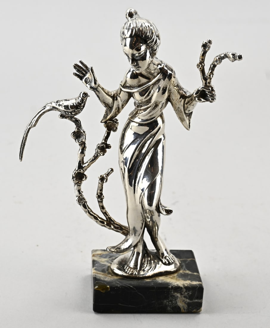 Silver figurine, woman with pheasant: Silver figurine of a Geisha with a bird. Mounted on a stone base. 15x5x19cm. Total weight with base 310 grams. In very good condition.
