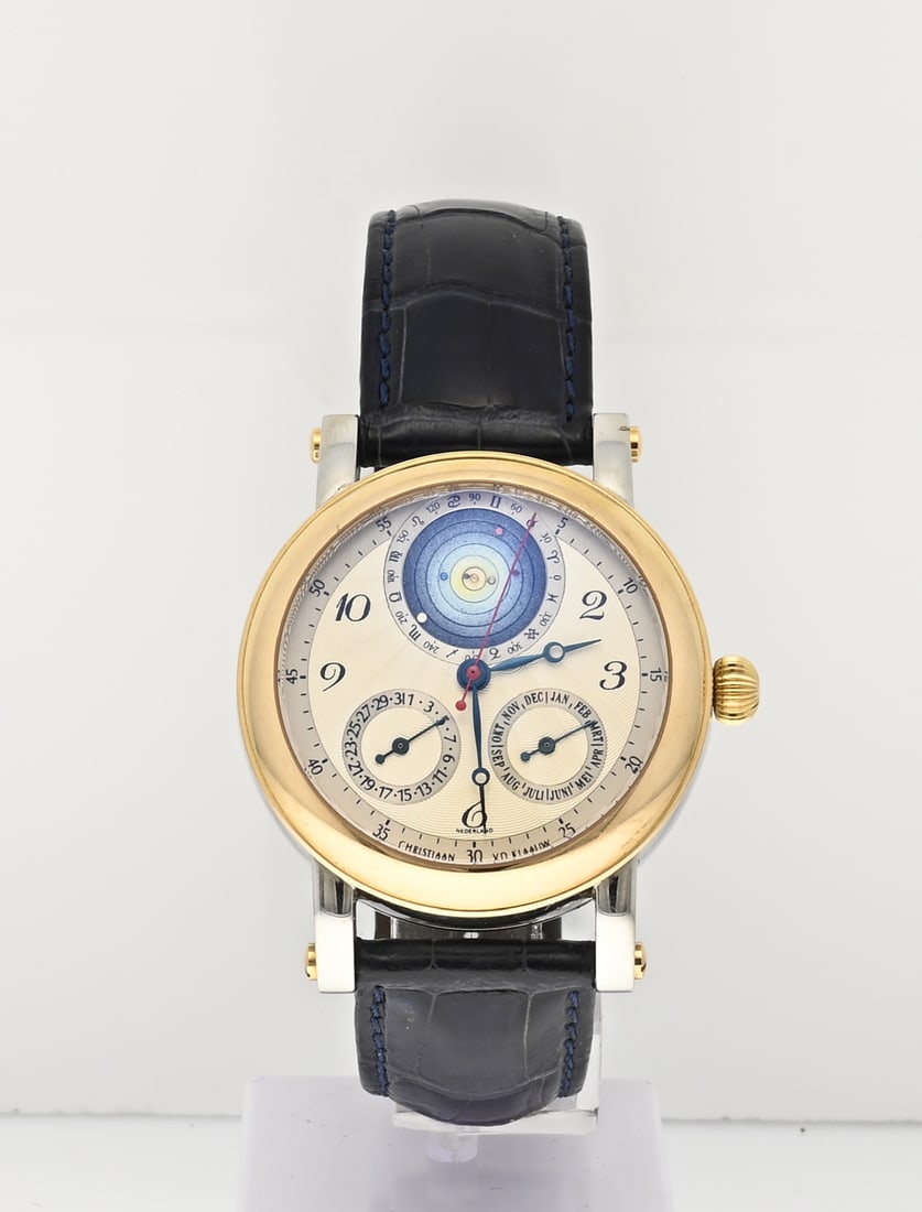 Christiaan van der Klaauw clock planetarium: Exceptional watch, Christiaan van der Klaauw, Planetarium 2000. Mechanical watch with date, month, and solar system. Features a steel case with a yellow gold bezel. The back of the watch features an