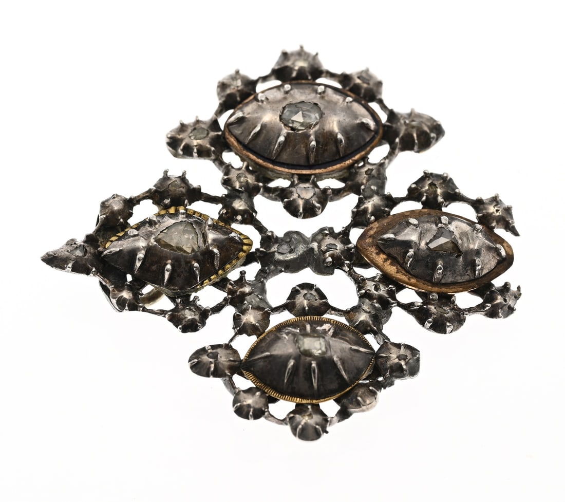 Silver pendant with antique diamond: Silver pendant with antique diamonds. Square-contoured openwork pendant with 4 marquise-shaped elements surrounded by rosettes, set with antique-cut diamonds. A small piece is missing from the