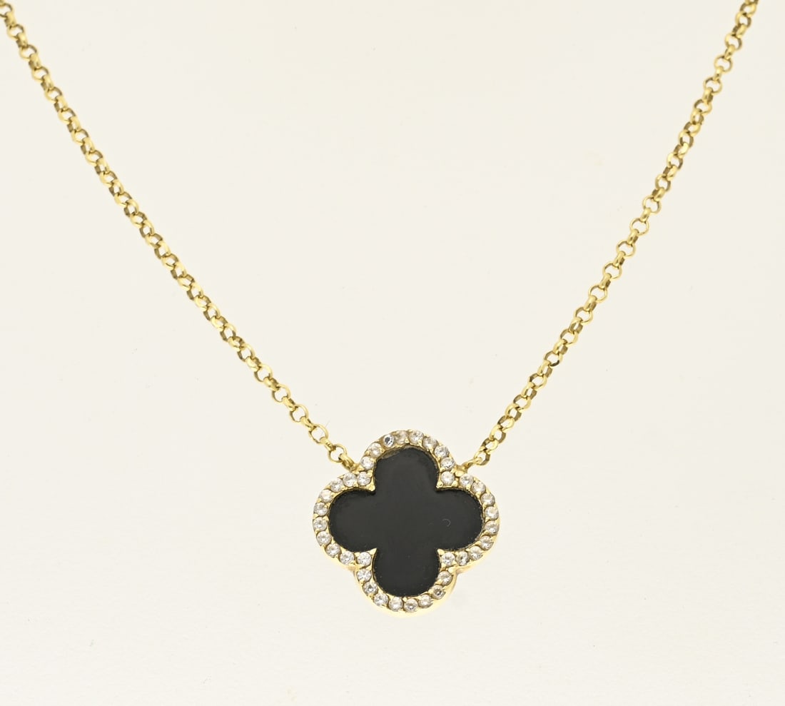 Gold necklace with clover, black: Yellow gold necklace and pendant, 585/000, with black element and cubic zirconia. Delicate anchor necklace with a calf-shaped element in the center set with a black element and a border set with