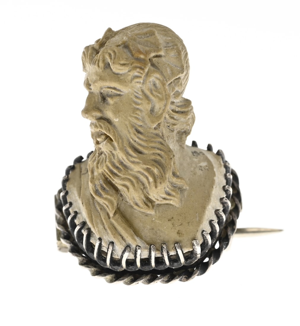 Brooch with Lava cameo: Exceptional carved lava cameo with a bust of a male figure, set in a silver border and pin. 26x17mm. Approx. 5.0 grams. In very good condition.