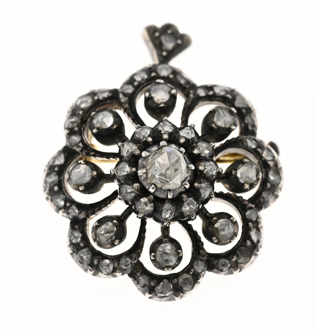 Brooch and pendant with diamonds: Brooch/pendant yellow gold and silver, 585/000 and 925/000, hallmarked, with diamonds. Flower-shaped with a double rosette set with rose-cut diamonds. The rim is fully set with small diamonds. ø
