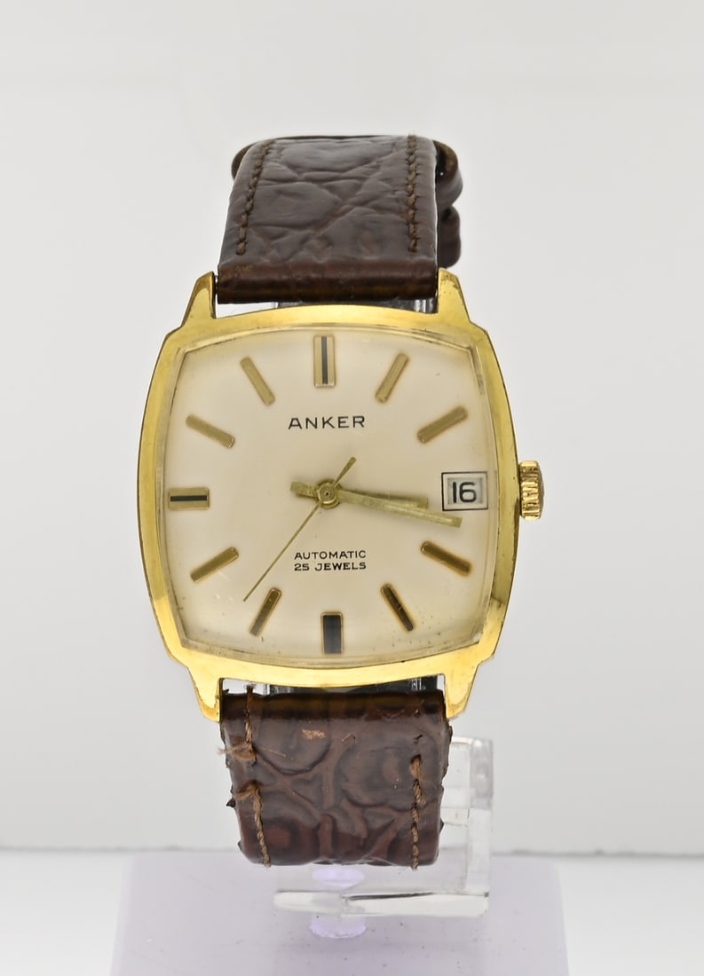 Vintage Anker watch: Vintage Anker watch, automatic, four-chamber contoured gold-plated case, fitted with a date display. Mounted on a brown leather strap. Working. Case slightly worn, otherwise in good condition.