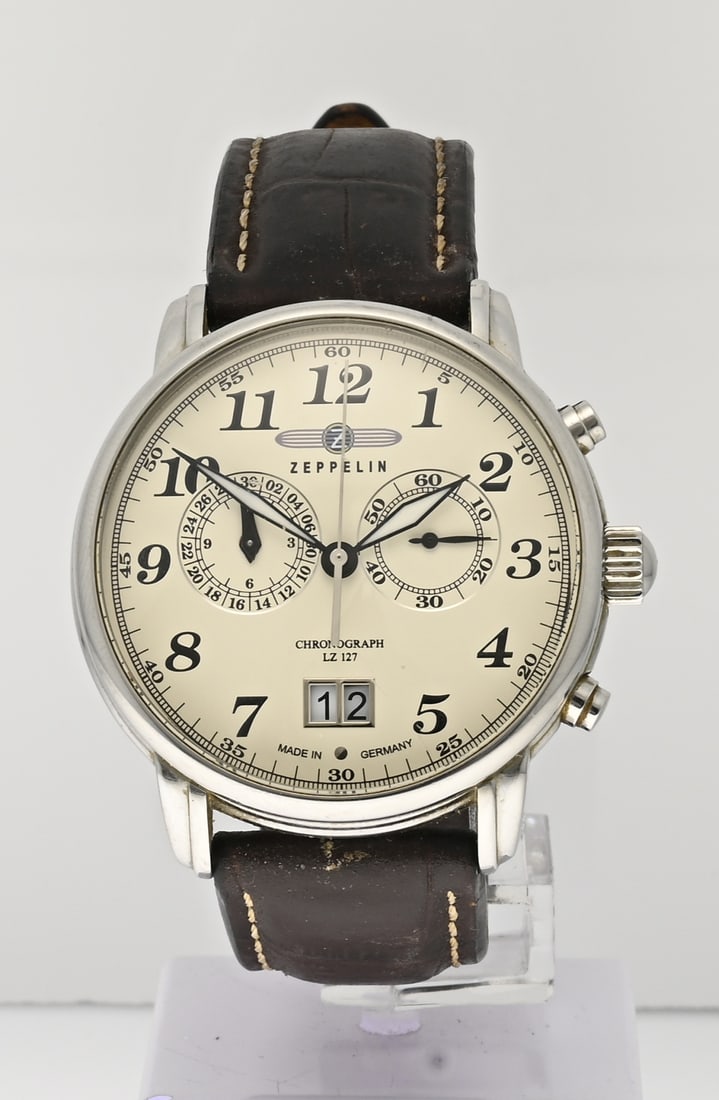 Zeppelin watch: Zeppelin watch, steel LZ127 Graf Zeppelin, quartz, chronograph and date display. Mounted on a brown leather strap. Case diameter 40 mm. 7643 / 8773. With brown leather strap, some wear. In original