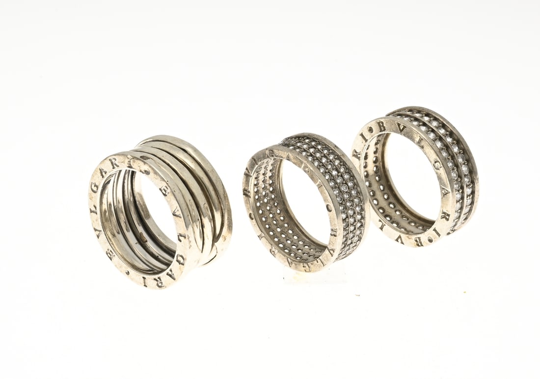 3 Silver rings: Three silver rings, 925/000, one wide ring, somewhat stretchy in width, 12 mm, ø 64, one ring with 2 rows of cubic zirconia, width 8 mm, ø 64, and one ring with 3 rows of cubic zirconia,