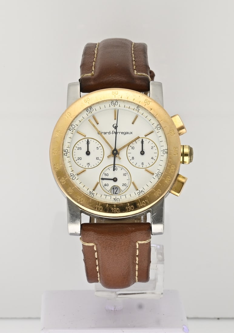 Girard Perregaux watch: Girard Perregaux watch, 7001, gold-plated steel, chronograph, quartz. Mounted on a leather strap. Case diameter 34 mm. No. BR-1866. 7700. Working. In good condition.