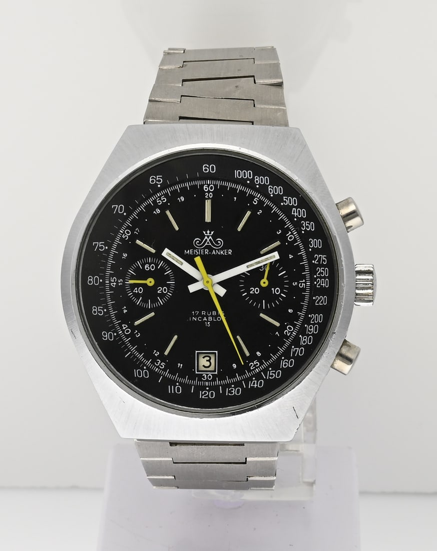 Meister-Anker chronograph: Steel Meister-Anker chronograph watch, mechanical, equipped with a stopwatch, date, and tachograph. Black dial with yellow accents. Case diameter 41 mm. 20 cm. Working. Signs of wear, otherwise in goo