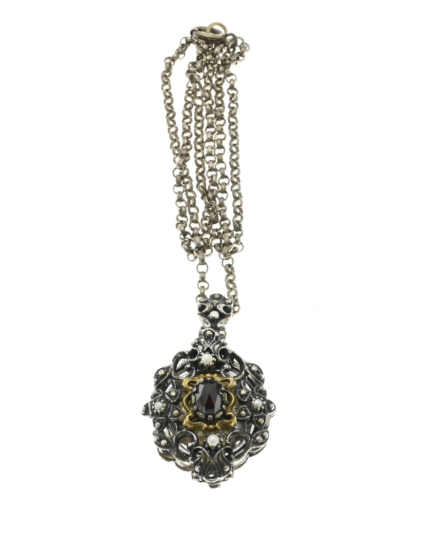 Silver pocket watch with garnet and chain: Silver pendant watch, 835/000, with an openwork case back set with pearls and a garnet stone, and a gold-plated bezel. The watch is attached to a short jasseron chain. Mechanical. Bartel & John. 47x26