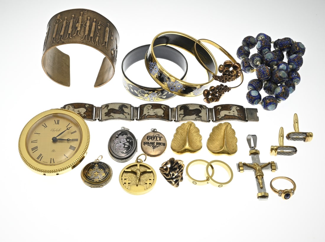 Lot of various jewelry: Lot of various jewelry, including gold-plated with enamel decoration, a necklace with cloison beads, a wide bronze bracelet with figures, and an alarm clock.