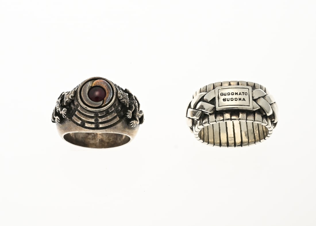 2 Silver rings: Two silver rings, a Buddha-to-Buddha ring, 925/000, wide model 12.5 mm. ø 60. And a signet ring, 835/000, with a red stone and 2 dragons as side pieces. Engraved on the inside: Ich atme tief und 