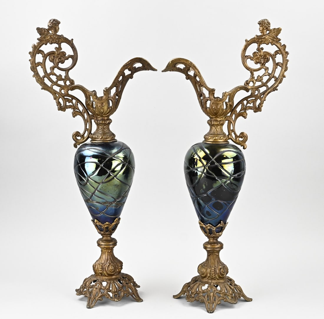 2x Ornamental goblet, H 59 cm.: Two antique decorative goblets of composite metal with iridescent glass. Loetz? Historicism. Circa 1890. Dimensions: H 59 cm. In good condition.