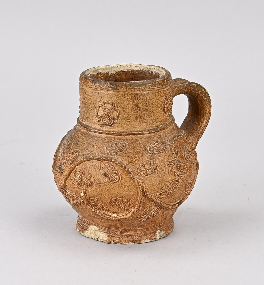 German Raeren stoneware jug, 11.5 cm.: 17th-century German Raeren stoneware jug with tendril/acorn decoration. Dimensions: 11.5 cm. In good condition.