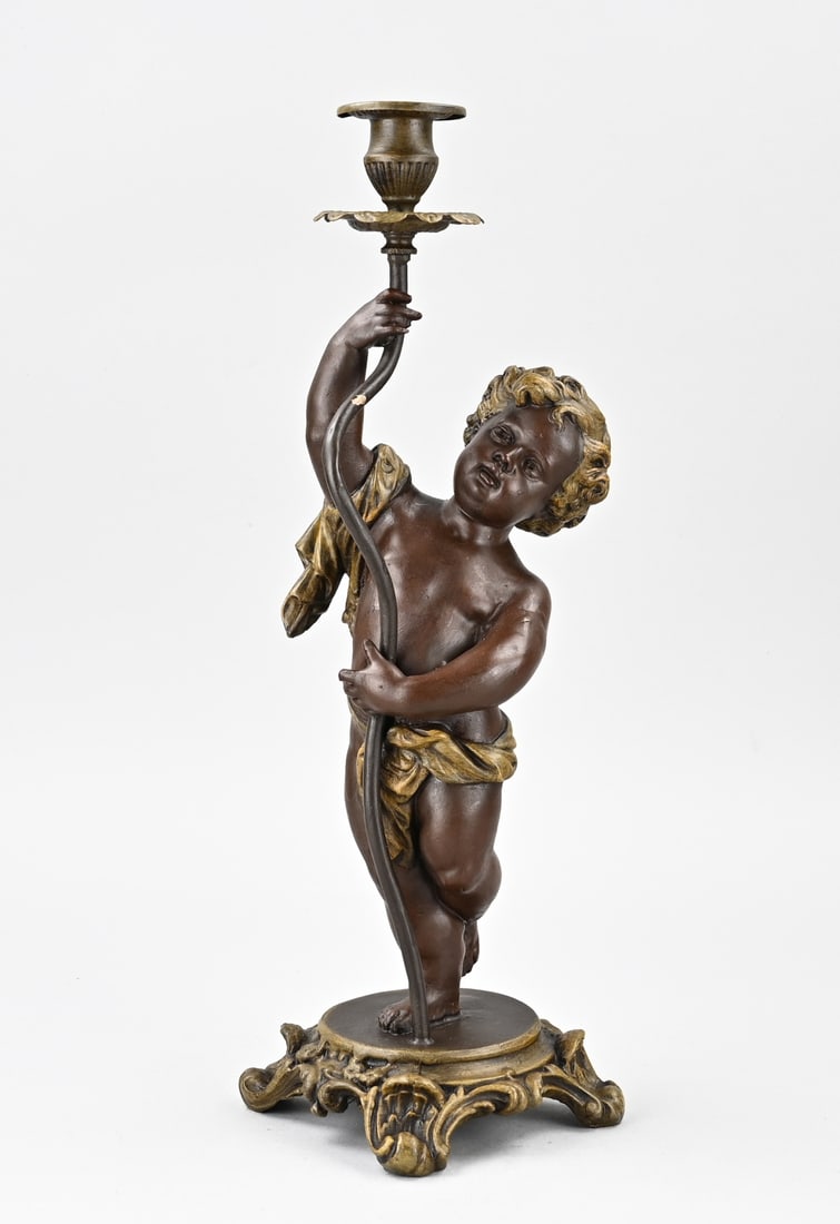 Candlestick, H 42 cm.: Antique composition metal putti candlestick. Circa 1900. Dimensions: H 42 cm. In good condition.