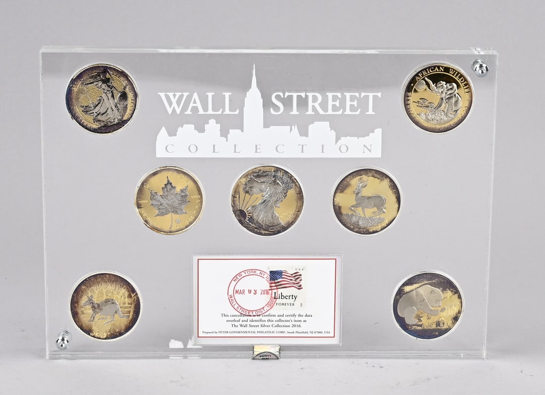 Wall Street silver coins: Wall Street silver coin collection in PVC from 2016. By Inter Governmental Philatelic Group South Plainfield USA. No. 2746/7500. 0.999/000. Dimensions: 17 x 24 x 2 cm. In good condition.