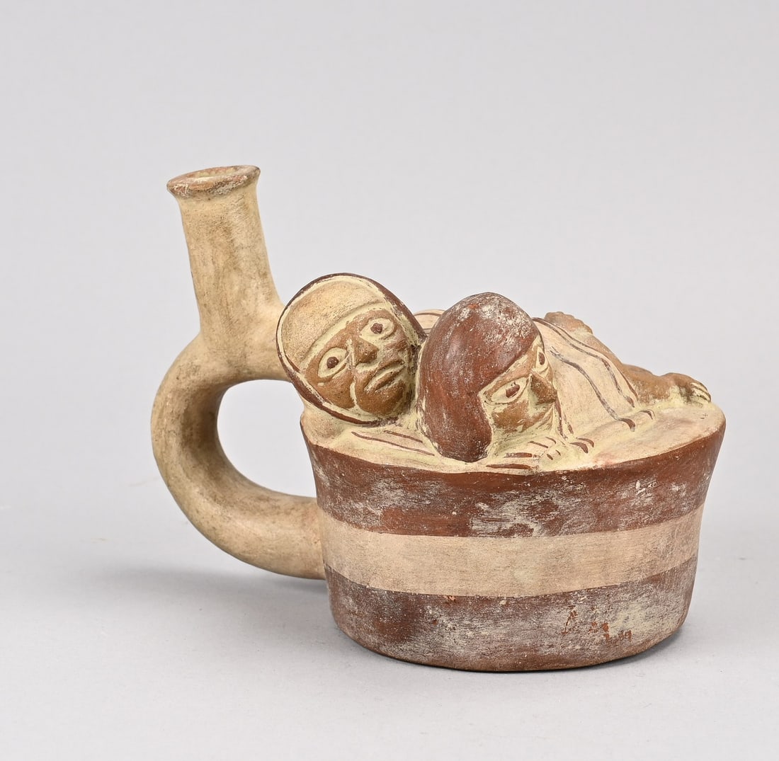 Antique stirrup flask (Peru): Peru. Pre-Columbian antique Moche culture terracotta stirrup flask with erotic depiction. Dimensions: 13.2 x 18.5 x 13 cm. In good condition.