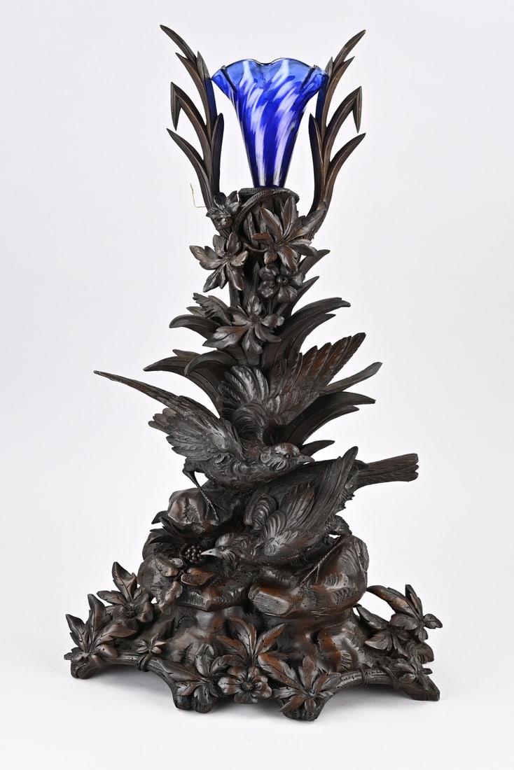 Black Forest carving, 1900: Large antique Black Forest carving from walnut with birds and glass flute. Circa 1900. Dimensions: 60 cm. Old wormhole. In reasonable condition.