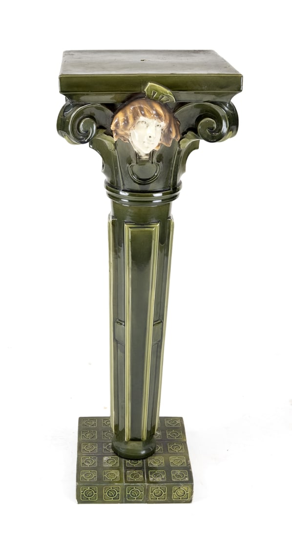 Majolica column, H 100 cm.: Large Art Nouveau majolica pedestal with a woman's face. 20th century. Dimensions: 100 x 45 x 45 cm. In good condition.