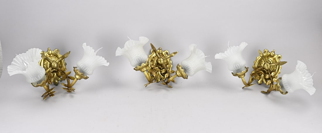 3x Wall lamp, 1900: Three antique bronze two-light wall lamps with frosted glass lampshades. Circa 1900. Dimensions: 20 x 38 x 19 cm. In good condition.
