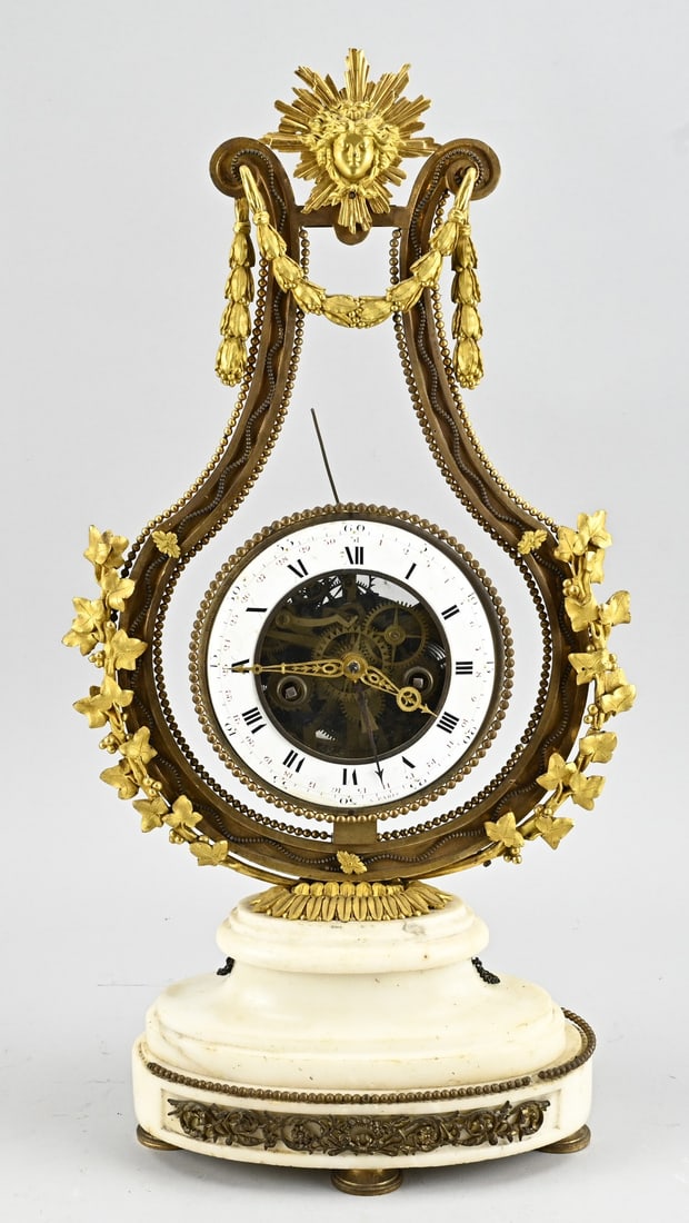 Lyra pendulum, H 53 cm.: 18th-century, French, Carrara marble lyra pendulum clock with beautiful skeleton movement. Eight-day movement, half-hour strike, date display. Pendulum missing. Dimensions: H 53 cm. In good condition.