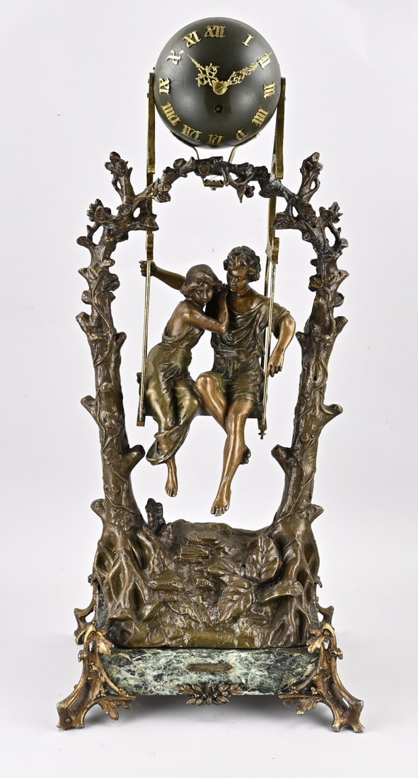 Mysterious French clock, 85 cm.: Antique, mysterious French clock with moving pendulum. Circa 1900. Metal composition with marble base. Dimensions: 85 cm. Functions not tested. In good condition.