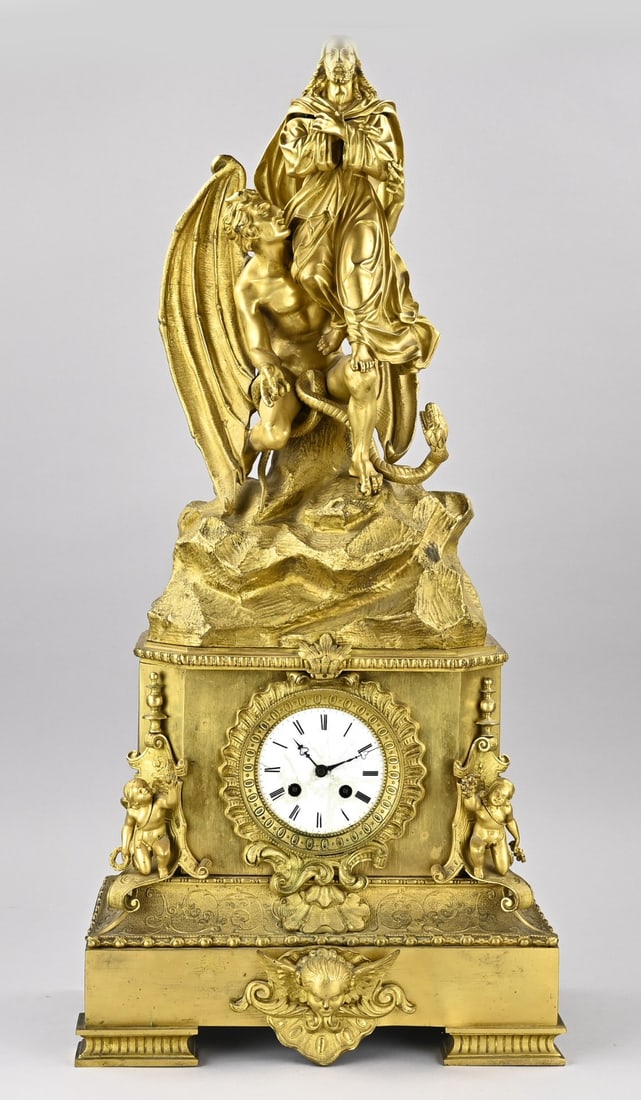 Exceptional Charles Dix pendulum, 74.5 cm.: Exceptionally large and rare fire-gilded bronze Charles Dix pendulum clock with devil, serpent, Jesus Christ, putti, and cherub heads. Eight-day movement, half-hour strike, spring pendulum.