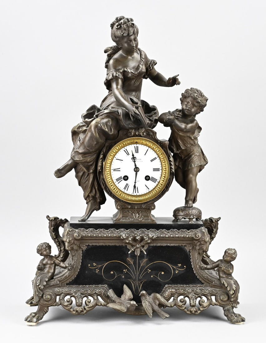 French pendulum clock, 1870: Antique French Louis Philippe pendulum clock with turtledoves, putti, and woman with book. With black marble front/base. Eight-day movement, half-hour strike. Circa 1870. Dimensions: 1870.