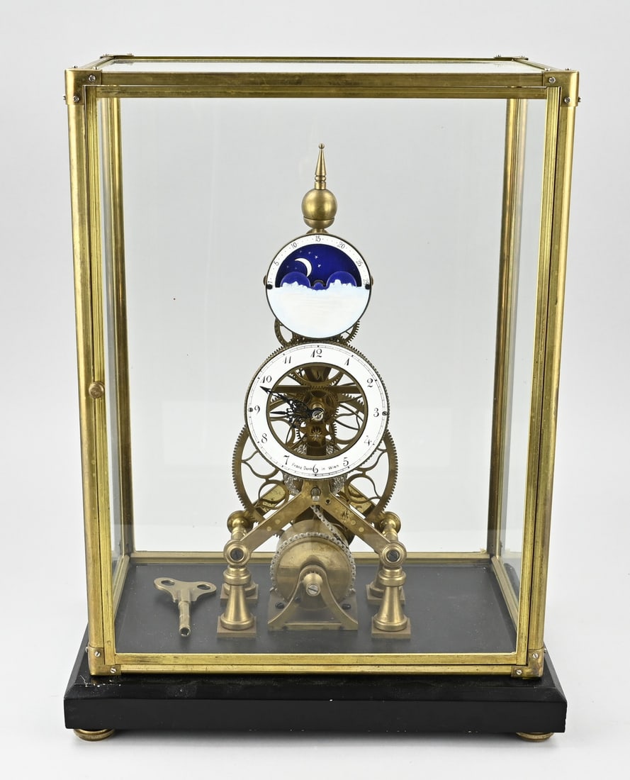 Skeleton clock (reproduction): Reproduction brass skeleton clock, after Franz Denk, Vienna. Second half of the 20th century. With snail cam, chain drive, and lever escapement. Dimensions: 25 x 45 x 35 cm. Not tested. In good