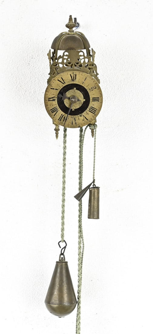 French lantern clock: Small antique French bronze lantern clock with verge escapement and alarm. 18th century. With short backstrike. Dimensions: 26 x 11 x 11.5 cm. In good condition.