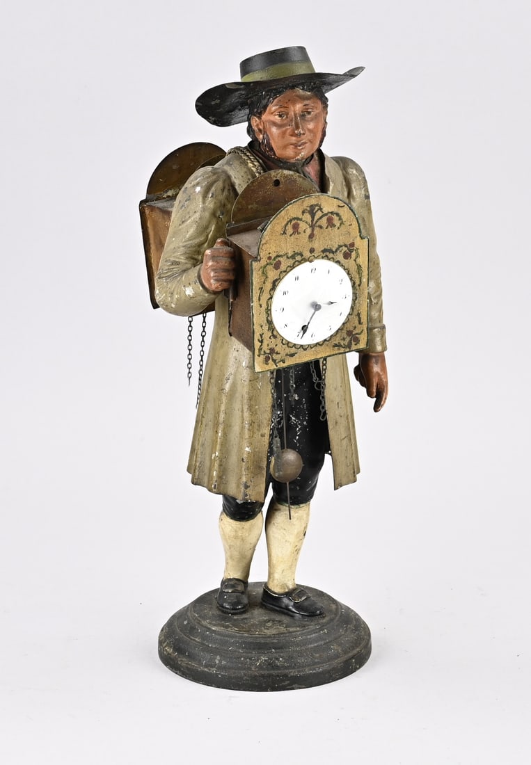 Little clockmaker: Antique, 19th-century German tin Black Forest clock seller with original polychromy. Dimensions: 37 cm. Untested. In good, unrestored condition.