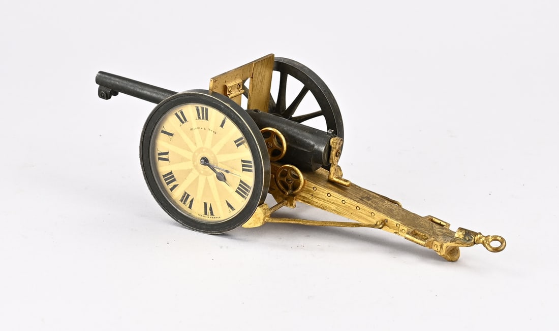 Desk clock (field cannon shape): Antique French bronze desk clock, Mappin & Webb (made in France). In the shape of a field cannon. Circa 1900. Dimensions: 25 x 9 x 8.5 cm. In good condition.