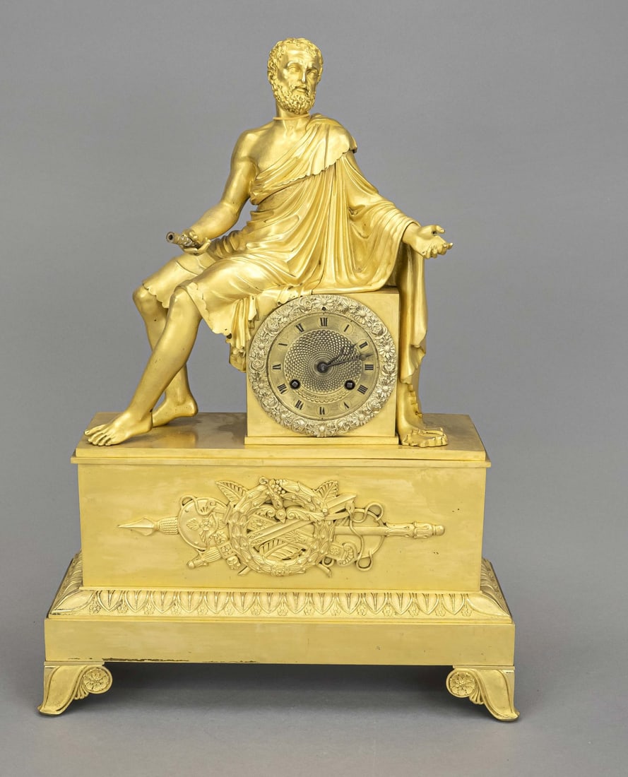 French ormolu mantel clock, 51 cm.: French fire-gilded bronze Empire pendulum clock with scholar. Circa 1820. Movement converted for spring pendulum. Something is missing from the figure's hand. Otherwise beautiful gilding. Dimensions: