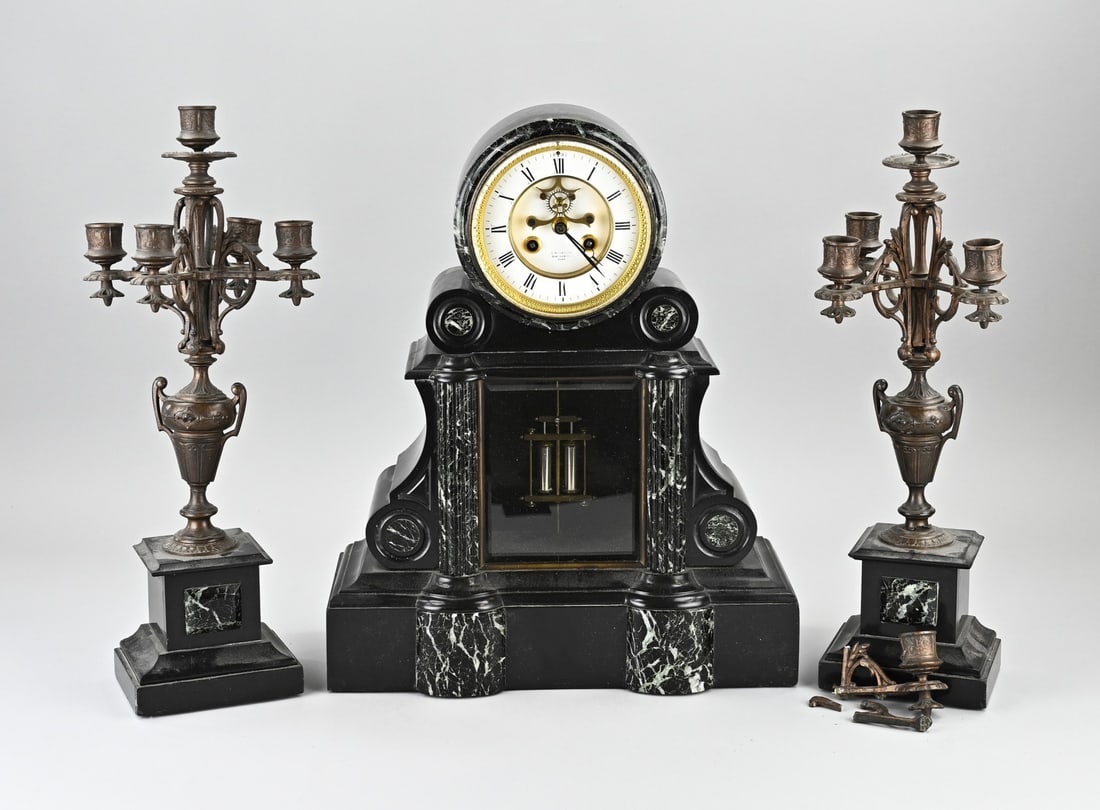 3-piece French clock set, 1880: Antique, French, black marble clock set with mercury pendulum and Brocot escapement. Circa 1880. Eight-day movement, half-hour strike. Minimal chip. Dimensions: 47 x 35 x 17 cm. In good condition.