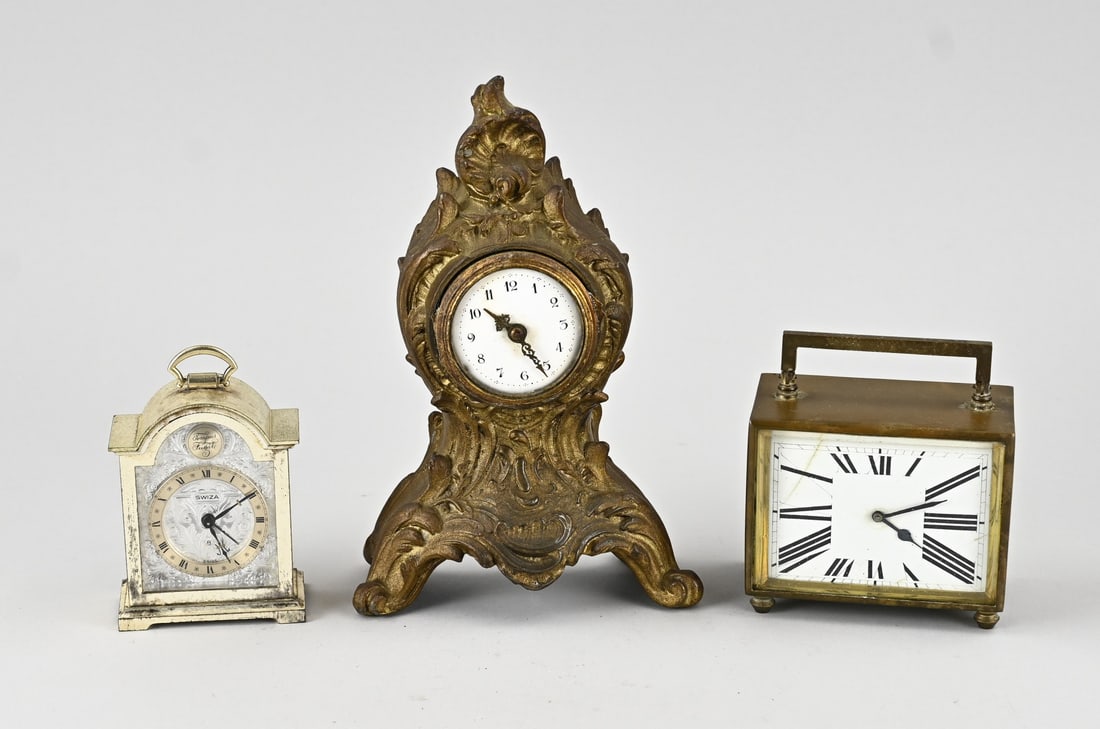3x Clock (miscellaneous): Three diverse old/antique clocks. 1x France, circa 1900, with escapement movement (Kartell). 1x Square, Art Deco, France, escapement, eight-day, hairline dial. 1x Swiza, brass plated, alarm clock.