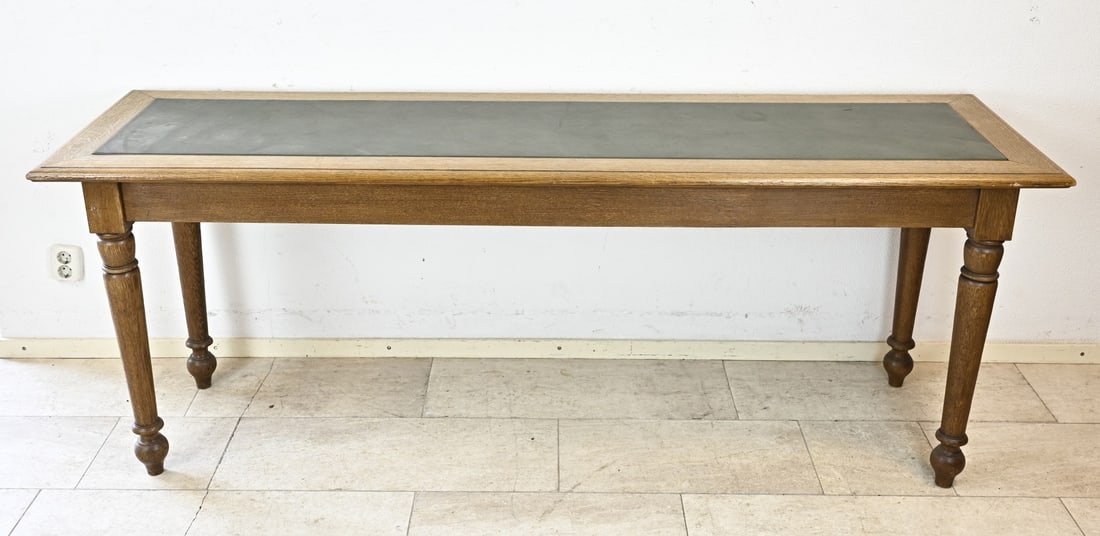 Large side table: Antique oak side table with green faux leather on the tabletop. Origin: Breda courthouse. Dimensions: 78 x 207 x 60 cm. In good condition.