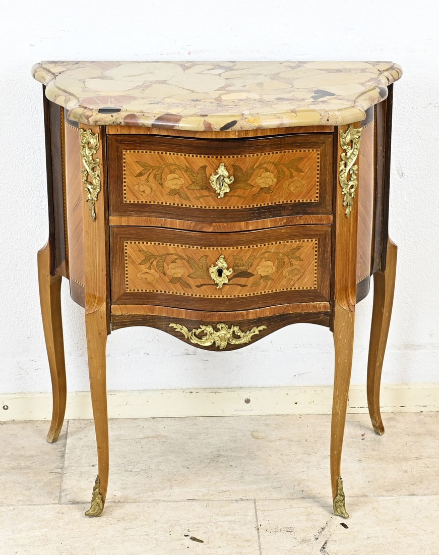 Small cabinet with marble top, 1900: Small, veneered French chest of drawers with two drawers, curved front, floral intarsia, gilded bronze mounts, and marble top. Circa 1900. Dimensions: 74 x 36 x 65 cm. In good condition.