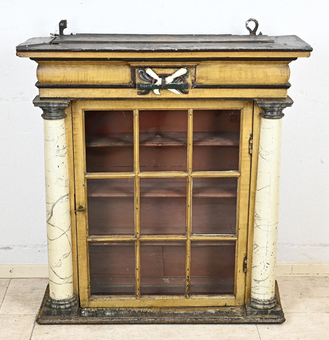 Surgeon/medicine cabinet, 1800: Large polychrome surgeon's/medicine cabinet with three-quarter columns and guild emblem carving. Circa 1800. Dimensions: 102 x 95 x 34 cm. In good original condition.