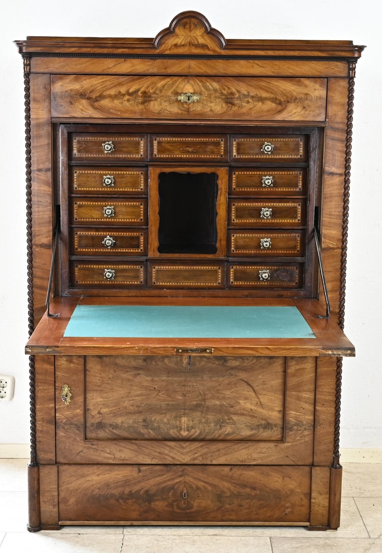 Mahogany secretary desk, 1850: Antique German, late Biedermeier, mahogany secretary desk with a beautiful inlaid nest and secret compartment. Circa 1850. Dimensions: 182 x 100 x 52 cm. In good condition.