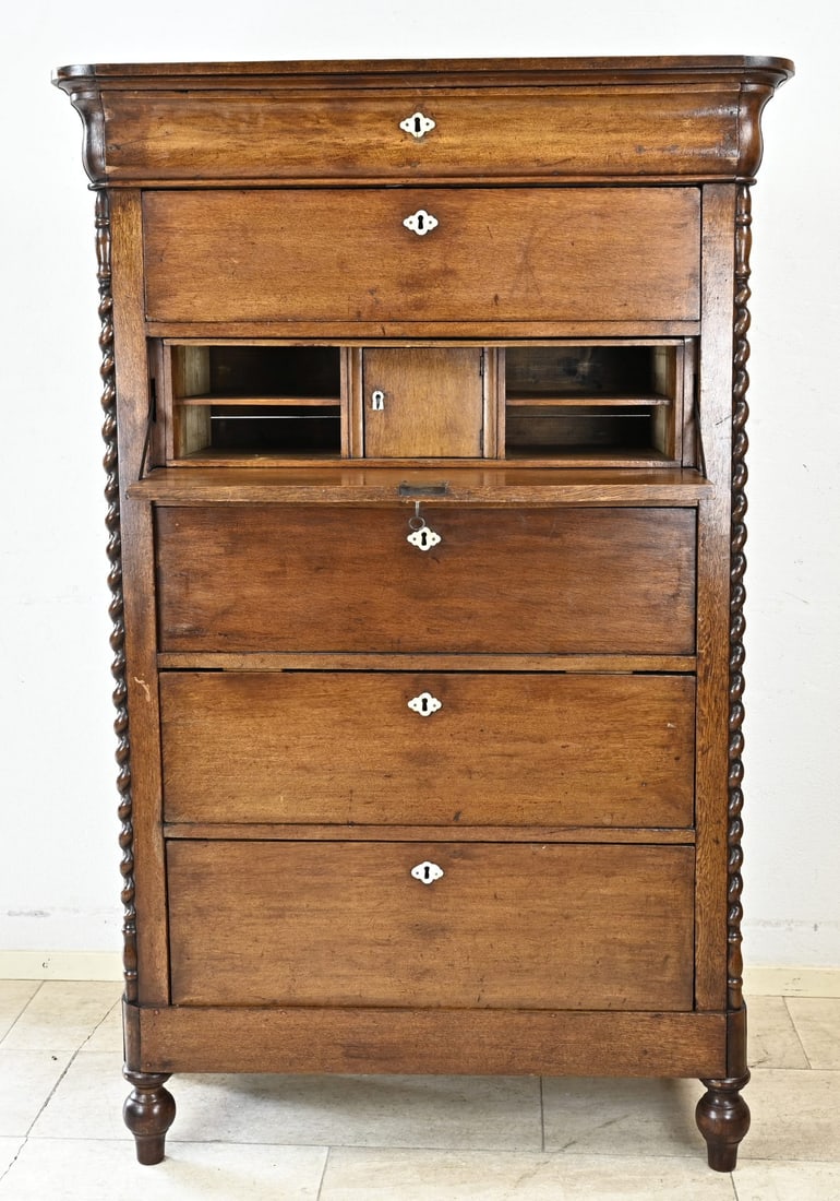 Oak chiffonier, 1840: Dutch oak Biedermeier chiffonier with half-twisted columns and six drawers. Circa 1840. Dimensions: 165 x 105 x 45 cm. In good condition.