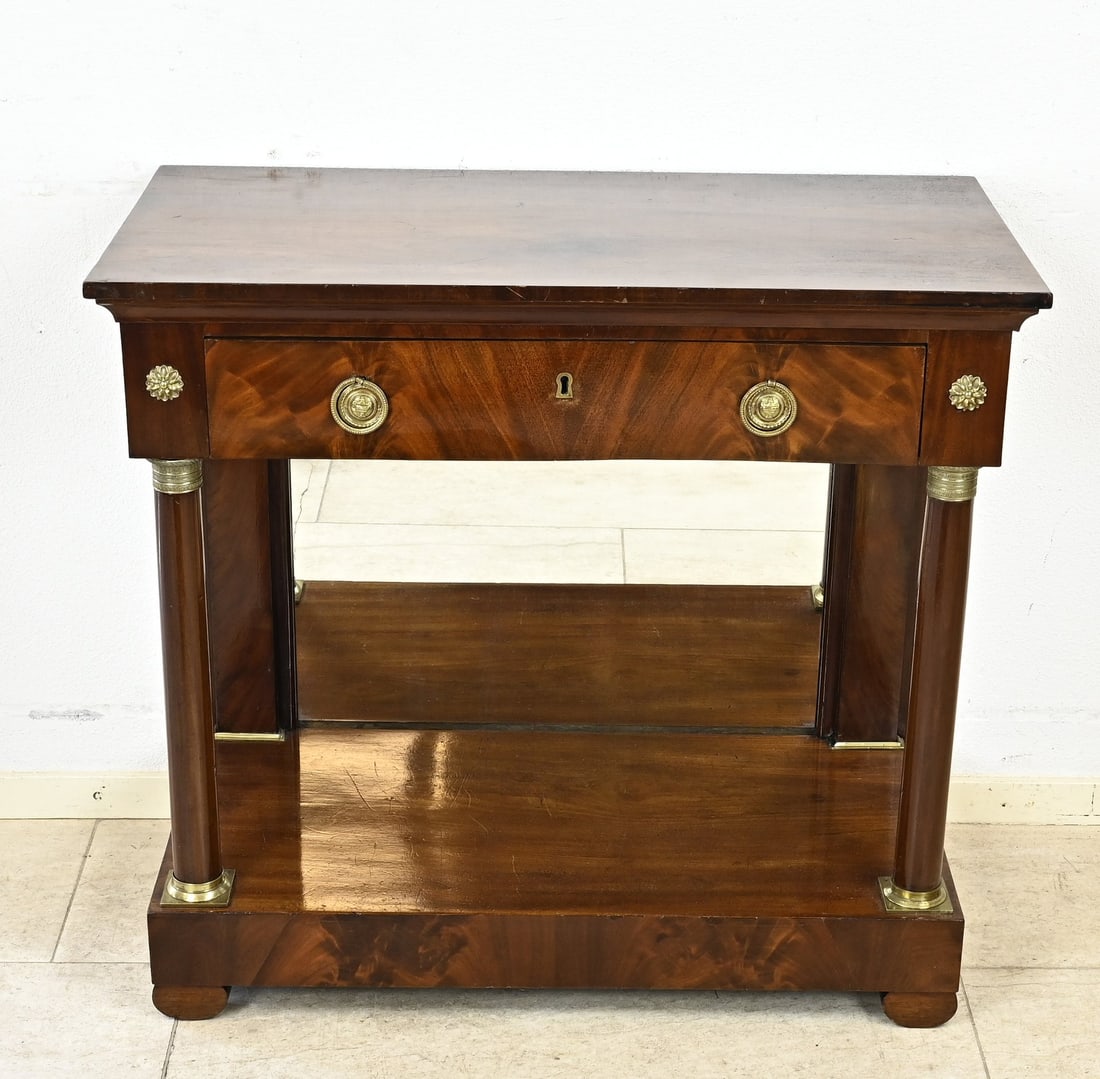 Mahogany trumeau, 1820: Dutch mahogany Empire trumeau with solid columns, drawer, and bronze decoration. Circa 1820. Dimensions: 79 x 85 x 44 cm. In good condition.