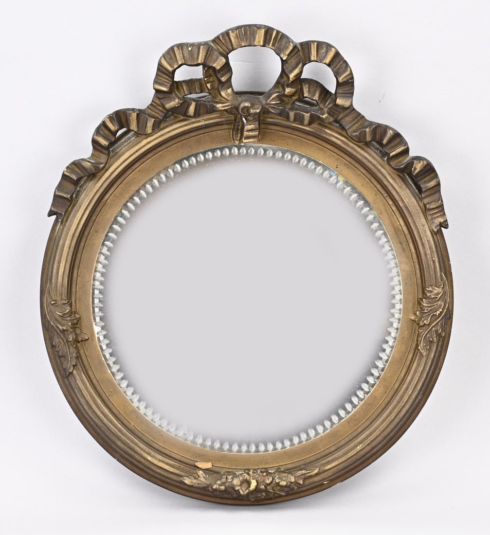 Antique bow mirror stucco frame, 1900: Antique round stucco mirror frame with Louis Seize bow. Circa 1900. Dimensions: 45 x 40 cm. In good condition.