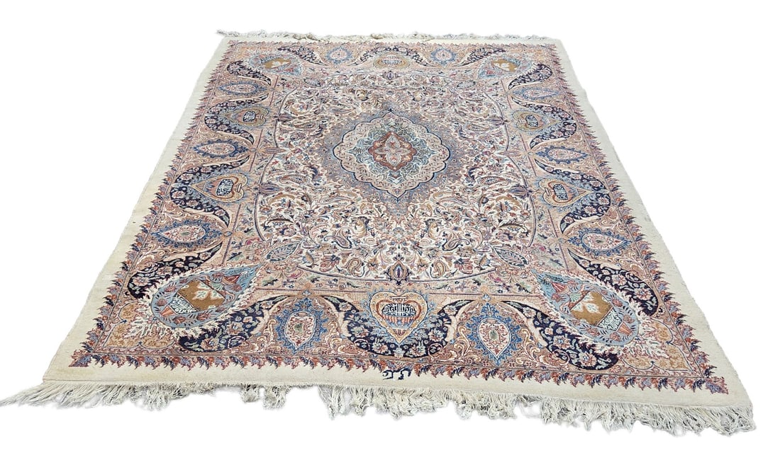 Persian rug, 360 x 245 cm.: Signed, hand-knotted Persian rug. Light in color, with various medallions and floral decoration. Dimensions: 360 x 245 cm. In good condition.