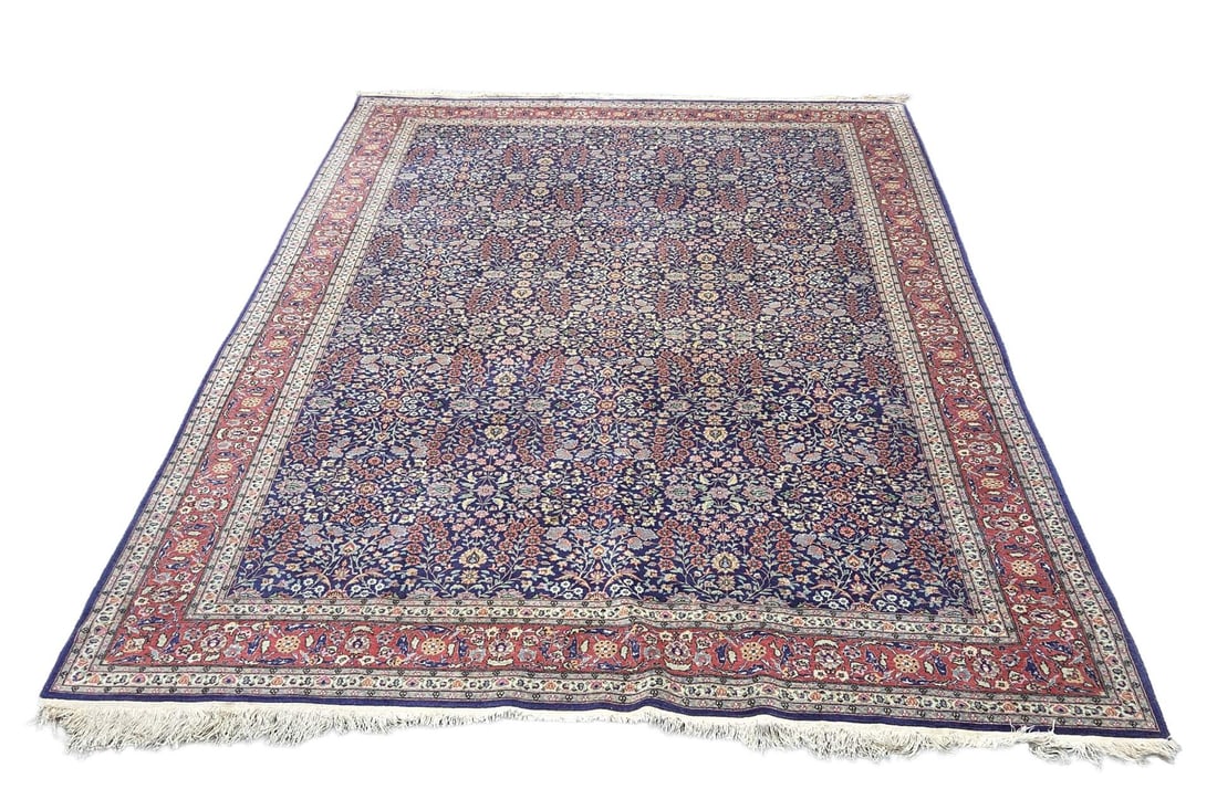 Persian rug, 370 x 245 cm.: Large hand-knotted Persian rug. Red/blue in color and entirely with floral decoration. Dimensions: 370 x 245 cm. In good condition.