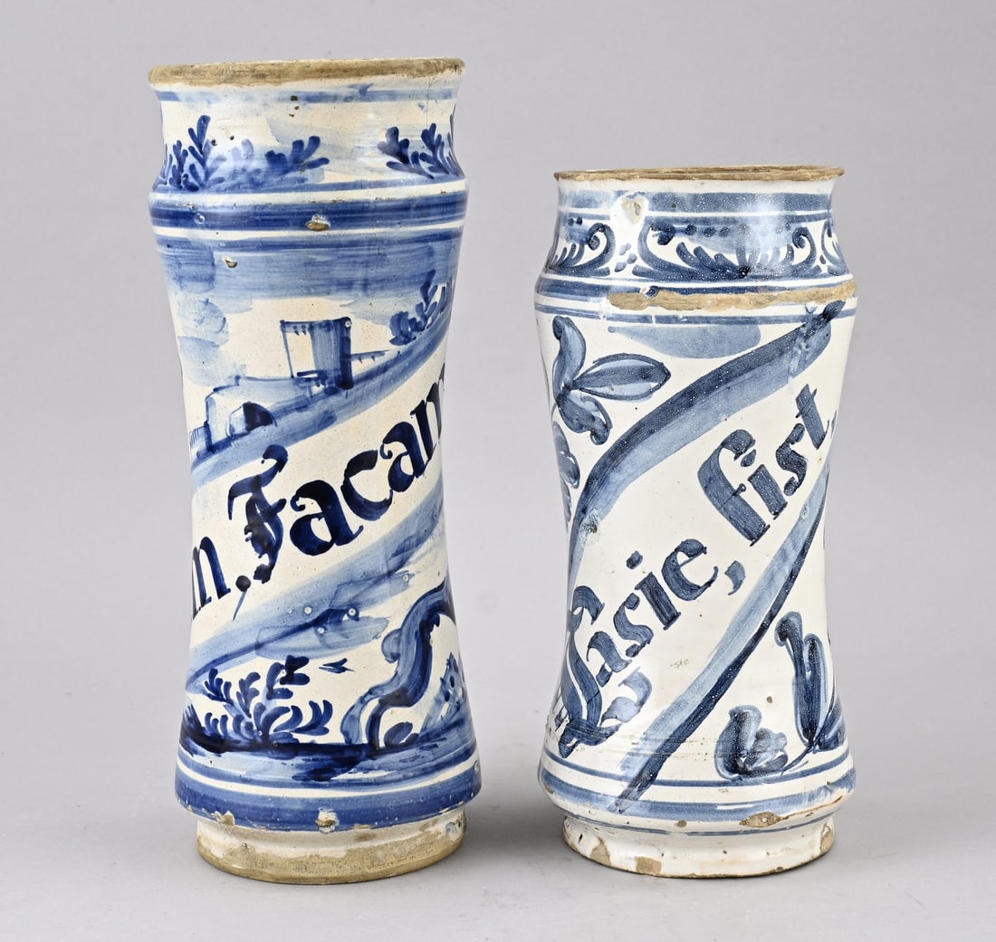 2x Albarello (Italy): Two antique Italian faience apothecary albarello vases. 18th - 19th century. Dimensions: 27 - 31.5 cm. In good condition.