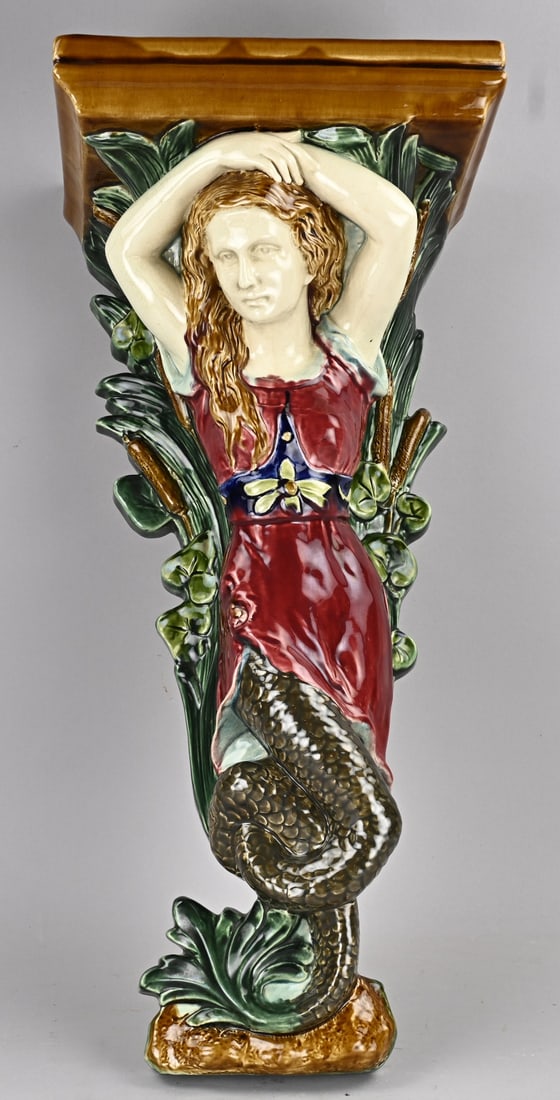 Majolica wall console: Old Art Nouveau majolica wall console with mermaid. Unmarked. 20th century. Dimensions: 65 cm. In good condition.