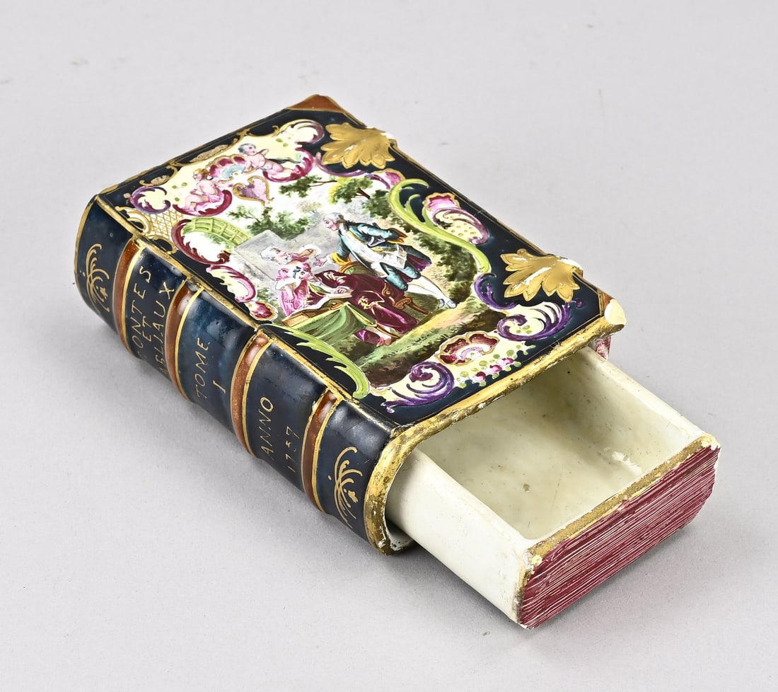 French faience holder in book form: 18th-century French polychrome book-shaped faience holder. Contes et Fabliaux Tome 1 Anno 1757. Dimensions: 12.5 x 9 x 4 cm. Inner holder damaged. In fair/good condition.